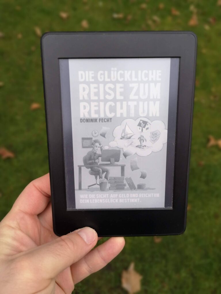 Die glückliche Reise zum Reichtum - Buchcover auf einem ebook Reader